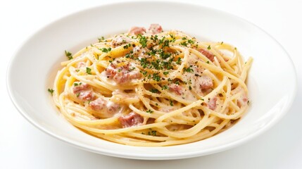 A delicious plate of creamy spaghetti carbonara topped with herbs, showcasing a traditional Italian dish, perfect for pasta lovers.