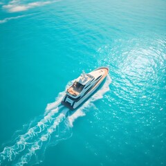 Naklejka premium High-angle aerial drone shot depicting a luxurious yacht traversing crystalin the Caribbean Sea on a sunn