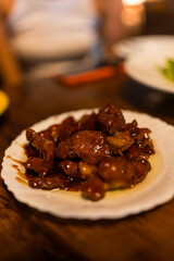 Pork of sweet soy sauce on white dish