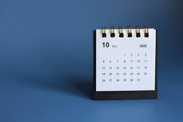 Monthly calendar template for the new year 2025 desk calendar,isolated on Blue background.