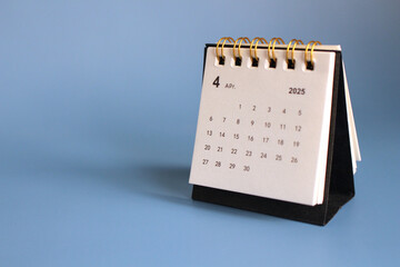 Monthly calendar template for the new year 2025 desk calendar,isolated on Blue background.