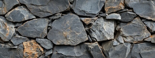 Fototapeta premium Grey and brown stone wall texture.