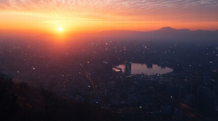 Stunning Sunset Over Cityscape with Calm Lake and Mountain View