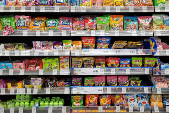 Kuala Lumpur, Malaysia - Dec 22, 2024: Assorted candies and gummy sweets displayed on supermarket shelves at Aeon Grocery. Brands like Haribo, Fruit Plus, Skittles, and Chupa Chups.