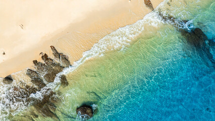 Nature of the beach and sea Summer with sunshine, sandy beaches, clear blue waters sparkling against the blue sky. On an island with good ecology and environment Background for summer vacation concept