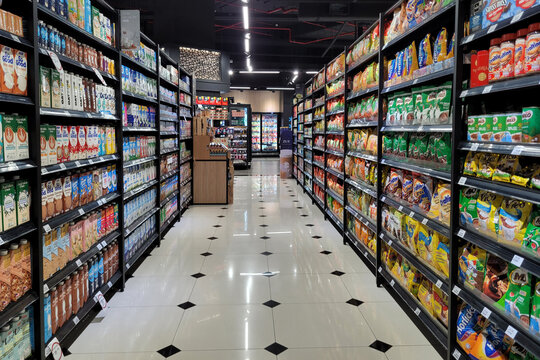Kuala Lumpur, Malaysia - Dec 23, 2024: A neatly arranged grocery aisle showcasing a variety of beverages, milk powders, and oat-based drinks at Mercato Grocery.