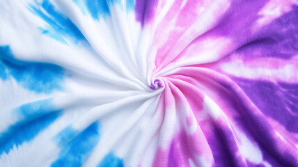 Obraz premium Colorful tie dye spiral pattern in blue pink and purple colors abstract swirl radial background with hypnotic creative design texture