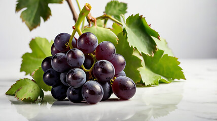 Fototapeta premium Succulent bunch of black grapes, white background 