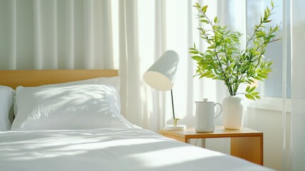 Sleep quality hygiene concept. Cozy bedroom with natural light, a lamp, and fresh flowers on a bedside table.