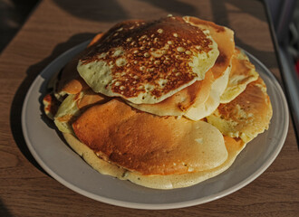 aromatic vanilla pancakes on a wooden table background
