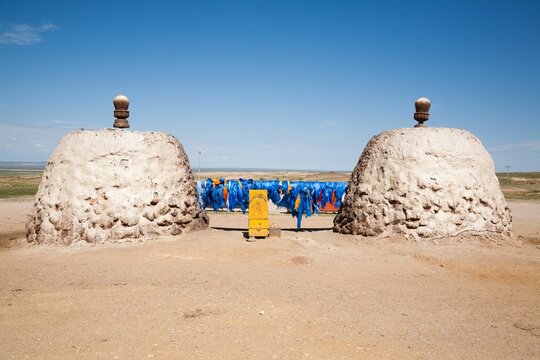 Mongolian ovoo shrine with blue khadag scarves.