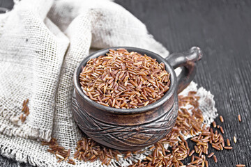Rice red in cup on board