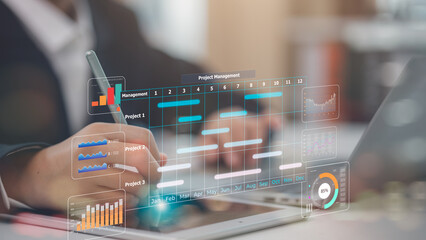 Project management concept. Site manager working with Gantt chart schedule to plan tasks and progress. Planning software. Corporate strategy for construction, finance, operations, sales, marketing.