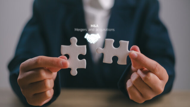 Business mergers and acquisitions concept. Share acquisition, asset business acquisition, amalgamation. Business review and development model. The abbreviation M and A