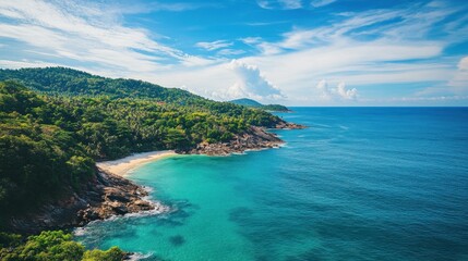 Obraz premium Tropical beach aerial view, turquoise ocean, green coast, cloudy sky, tourism destination
