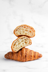 Croissants on white marble background