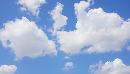 A vibrant blue sky dotted with fluffy white cumulus clouds