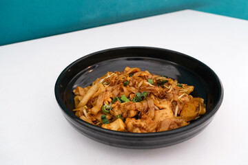 Kwetiaw or Kwetiau, fried rice noodles with meatballs and vegetables. Popular in Indonesia
