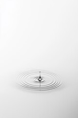 Water Drop Impact Creating Ripples on Calm Surface in Minimalist Setting