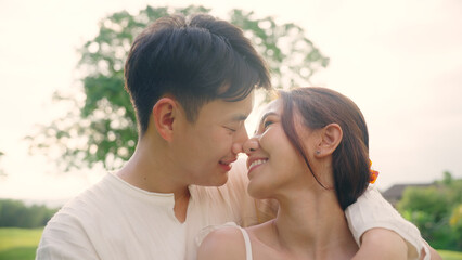 Young adult asia people fiance happy lover flirt fall in love nose kiss hug cuddle care trust....