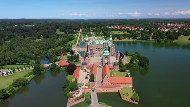 Aerial View Of Frederiksborg Castle In Hillerod, Denmark. - pullback shot