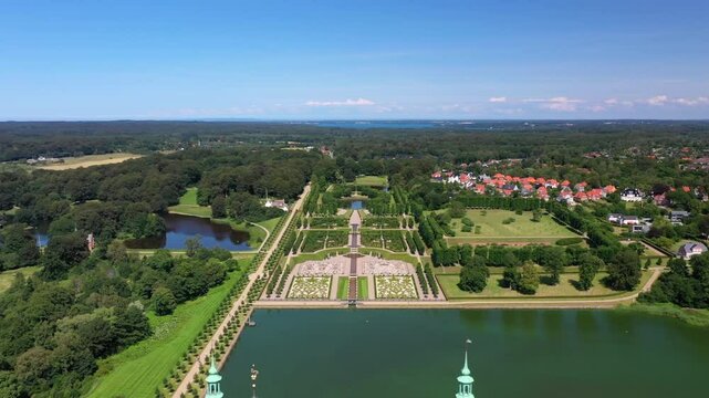 Baroque Garden Of Frederiksborg Castle In Slotssoen In Hillerod, Denmark. - aerial shot