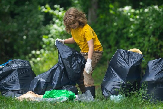 Child boy picking up plastic bottle outdoor. Save environmental and reduce waste concept. Recycle waste, litter rubbish garbage trash junk clean. Ecology concept. Environment plastic pollution.