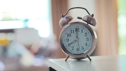 Alarm clock with short hand pointing to number 8.00