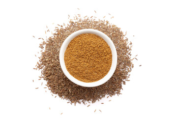 A bowl of Organic Caraway seeds (Carum carvi) powder, placed over a heap of whole Caraway seeds. Isolated on a white background.