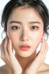 Fototapeta premium A detailed close-up of an Asian woman highlighting her glowing skin and soft makeup