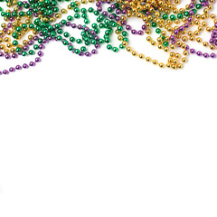 Mardi gras beads on white background