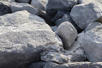 Closeup look at large size rock on beach coast