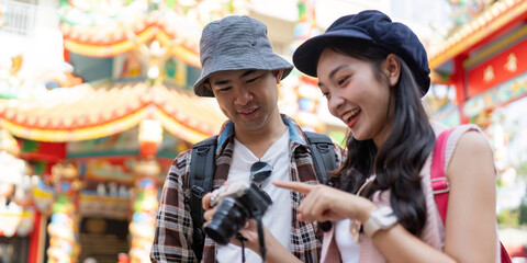 Travel adventures together a couple capturing memories at a colorful cultural festival
