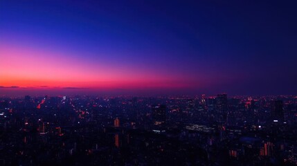 A vibrant city skyline at dusk, illuminated by city lights.