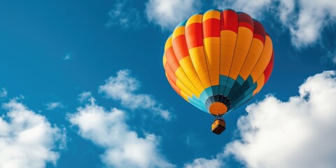 Vibrant hot air balloon soaring against a blue sky