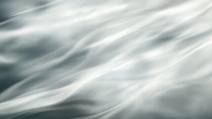 Obraz premium Abstract gray and white silky fabric waves background texture.