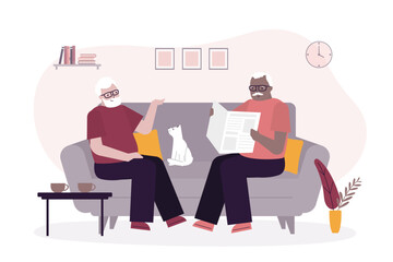 Elderly man spending a relaxing day enjoying their hobbies sitting in the living room at home talking and reading. Aged people together, multiethnic grandfathers, friends