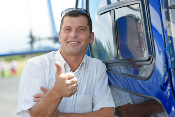 a helicopter male with thumb-up