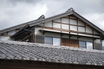 Traditional wooden windows and roof pattern in an old Japanese house.
