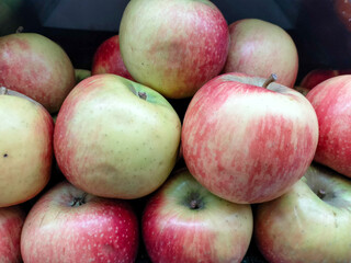 Fresh apples on the market. Agricultural background texture