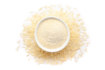 A bowl of Organic Rice Flour, placed over a heap of White rice (Oryza sativa). Isolated on a white background.