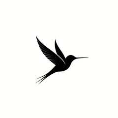 Silhouette of a hummingbird in flight.