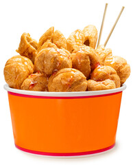 Deep fried fish balls in paper bucket isolated on white background, Deep fried fish balls with spicy sauce on white With work path.