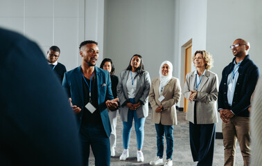 Successful CEO leading staff training workshop in modern office setting