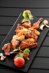 Mexican fried chicken placed on a black slate