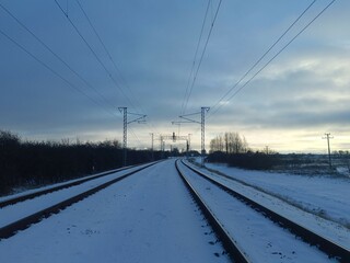 Two way railroad tracks in countryside. Two railway tracks. Sunny day. Countryside. Fields and...
