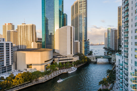 Aerial view of beautiful skyscrapers and the Miami River at sunset with a vibrant skyline, Brickell, USA.