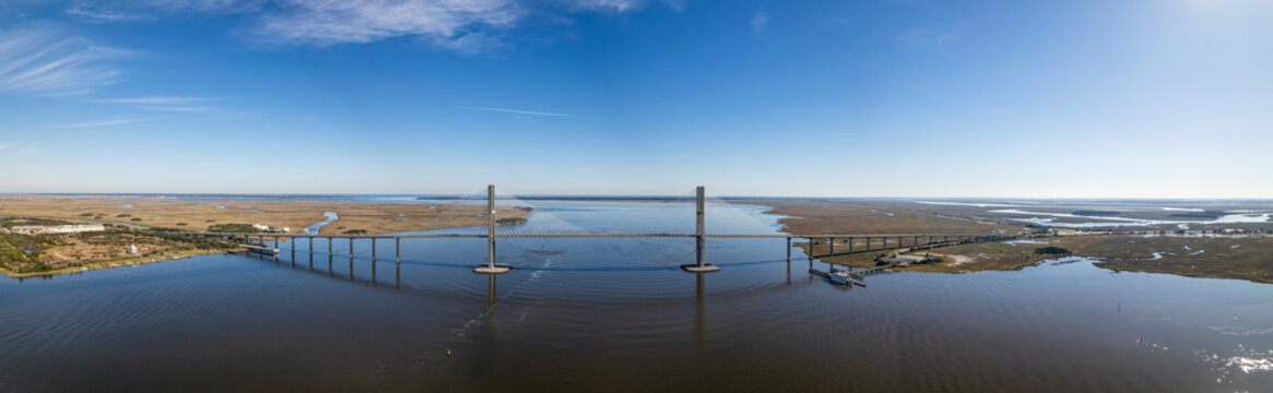 Aerial view of the majestic sidney lanier bridge spanning the tranquil brunswick river under a clear blue sky, brunswick, georgia, usa.