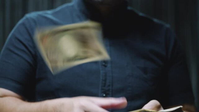 A man scattering Japanese yen banknotes