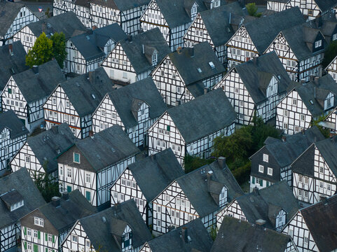 Aerial view of historic half-timbered houses in a beautiful village at sunrise, Freudenberg, Germany.